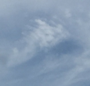 Cara del demonio en las nubes